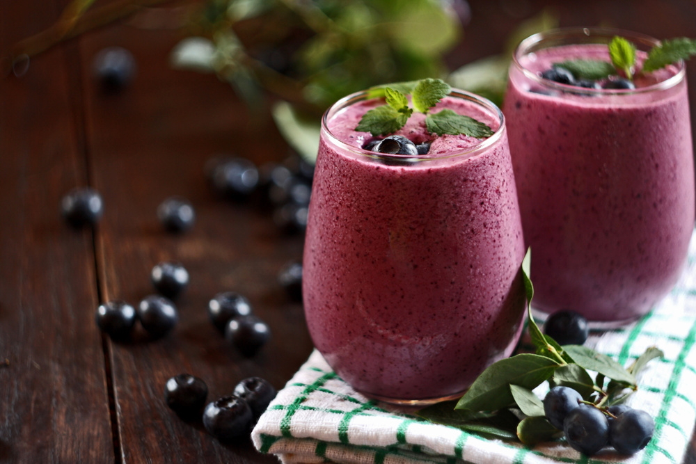 Two glasses of blueberry smoothies