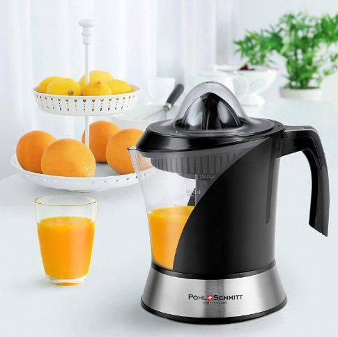 an electric citrus juicer with oranges