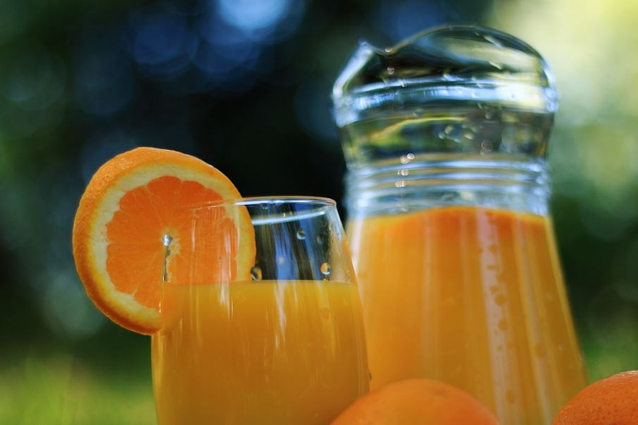 fresh orange juice in pitcher and glass